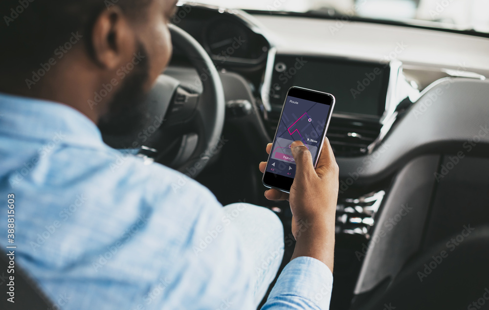 Poster african driver using smartphone with car navigation app driving auto