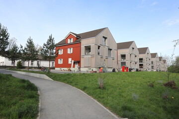 Fototapeta na wymiar Gemeinde Cham, Kanton Zug (ZG)/ Switzerland - April 19 2020: Renovated residential houses in Hagendorn, Switzerland