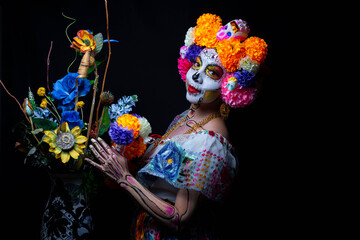 Woman personified as catrina on the day of the dead 