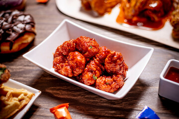 Boneless Wings Shaken in Barbecue Sauce in White Plate