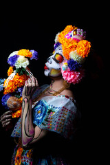 Woman personified as catrina on the day of the dead 
