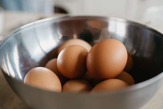 Eggs in the stainless steel soup bowl in the kitchen
