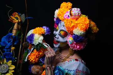 Woman personified as catrina on the day of the dead

