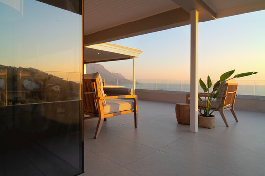 Luxury home showcase patio with tranquil sunset ocean view