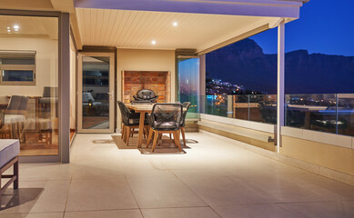 Dining table on luxury home showcase patio at night