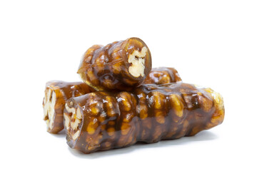 Traditional Turkish flavor made by dipping walnuts with a rope in a mixture of grape molasses. isolated on white background.