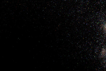 glitter sparkle powder background isolated on black background, star glitters background