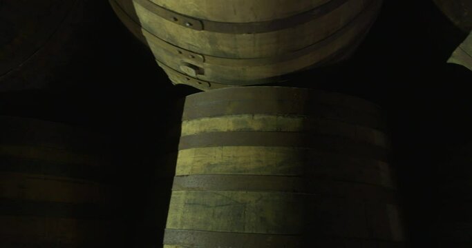 Wooden keg cask barrels whisky alcohol wine cellar warehouse overhead smooth shot