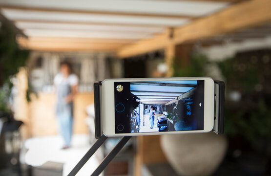 Smart phone screen business owner filming vlog in plant nursery