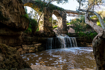 Harod Stream in the Beit She'an Valley. Waterfall and old aqueduct in the eucalyptus grove. Beit Shean valley. Israel