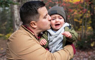 Father And Son Hugging On Outdoor in autumn