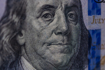 Selective focus on detail of 100 dollars banknote. Close up macro detail of money banknotes,...
