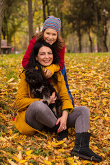 Fototapeta premium Cheerful mother and son in park