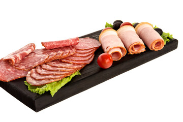 An appetizing snack made from pieces of raw smoked sausage, olives, tomato on a black kitchen serving board.