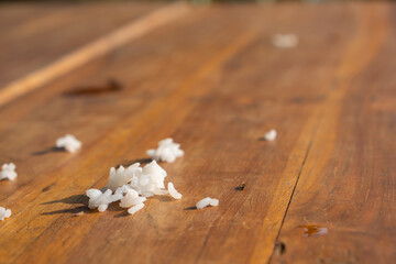 Obraz na płótnie Canvas Spilled rice on the wooden floor