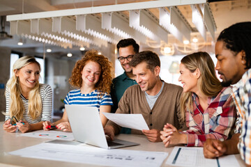 Happy creative designers, business people brainstorming in office