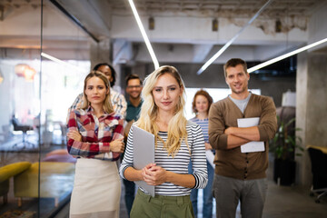 Successful company with happy employees in modern office