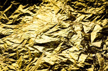 Gold background. Crumpled foil.  paper is Golden in color.