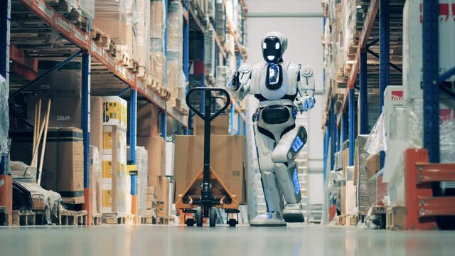 Cyborg is putting boxes onto the trolley in the warehouse
