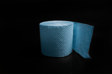 blue toilet paper on black background