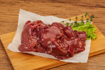 Raw chicken liver over board