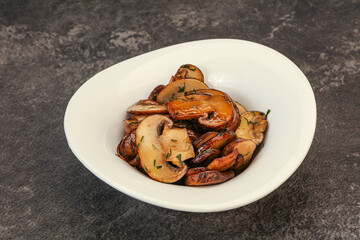 Roasted champignon with herbs and spices