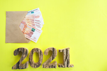 On a yellow background, an envelope with money, Russian five thousandth rubles. Economy concept,...