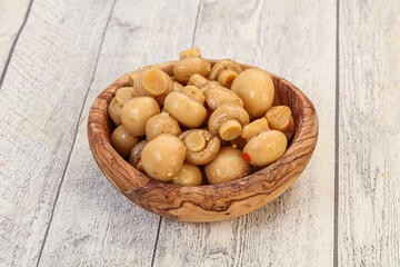 Pickled champignons in the bowl