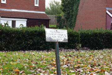 Parking sign sitting in a parking spot