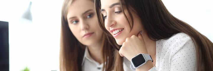 Portrait of smart businesswoman sitting at comfortable workplace and looking at something in important document and smiling. Accounting office concept