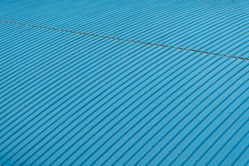 Old blue corrugated metal cladding on roof