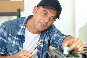repairman choosing correct socket from his toolkit