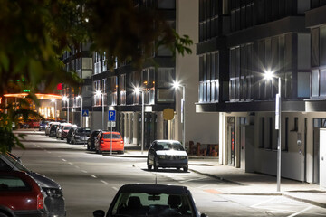 night street near the apartment building with modern LED street lights