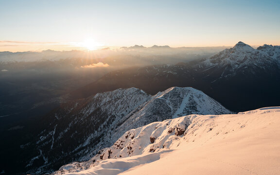 View of Serles, a mountain in the Stubai Alps, south of Innsbruck, the capital city of the Austrian province of Tyrol during gorgeous sunrise. Snowy mountain peaks
