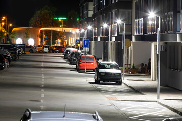 night street near the apartment building with modern LED street lights