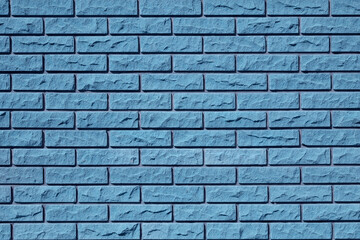 Blue brick wall texture, stone background. Decorative modern tile for facade finishing. Abstract architectural pattern. Building facade design.