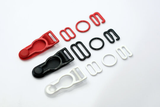 Linen fittings adjusters, rings holders stocking metal fittings painted in black, white, red. Elements of lingerie.