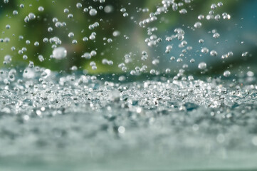 Raindrops splashes close-up.
