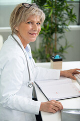 senior doctor in her office