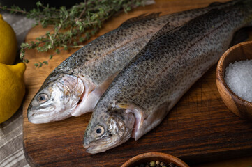 fresh trout on wooden cutting board