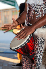 An African drummer plays the djembe.