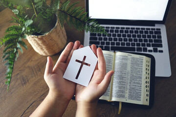 Man praying by faith with computer laptop, Church services online concept, Online church at home...