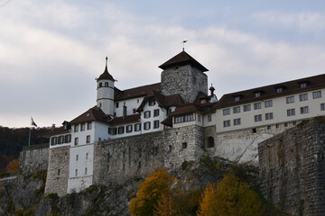 Fototapeta na wymiar Aarburg /Switzerland - 10 25 2020: Castle Aarburg in lateral view in autumn with overcast sky. It used to serve as fortification above river Arae.