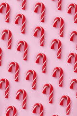 Christmas background of candy cane on pink background