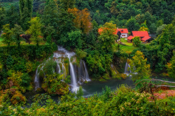 Fototapeta na wymiar Waterfall Vilina Kosa. RASTOKE, CROATIA - august.2020. - Ethno village Rastoke in Croatia is located in the town of Slunj close to Plitvice lakes. Rastoke is known for its water powered mechanical mil