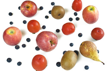 Apples, blueberries, persimmons, pears and kiwi on white background.