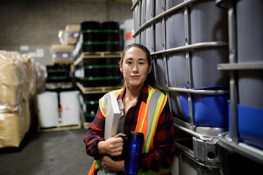 Portrait of female distribution warehouse worker