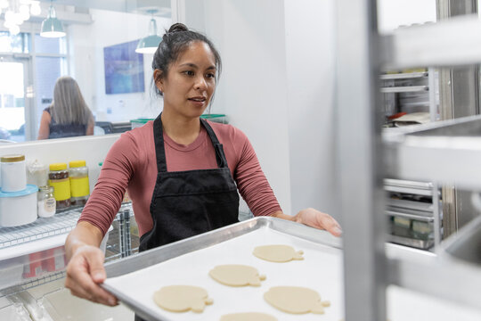 Baker Holding Tray Of Cookies