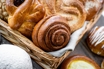Fresh pastries buns wicker basket rustic style bakery