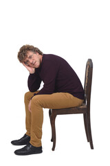 side view of a man sitting on white background,